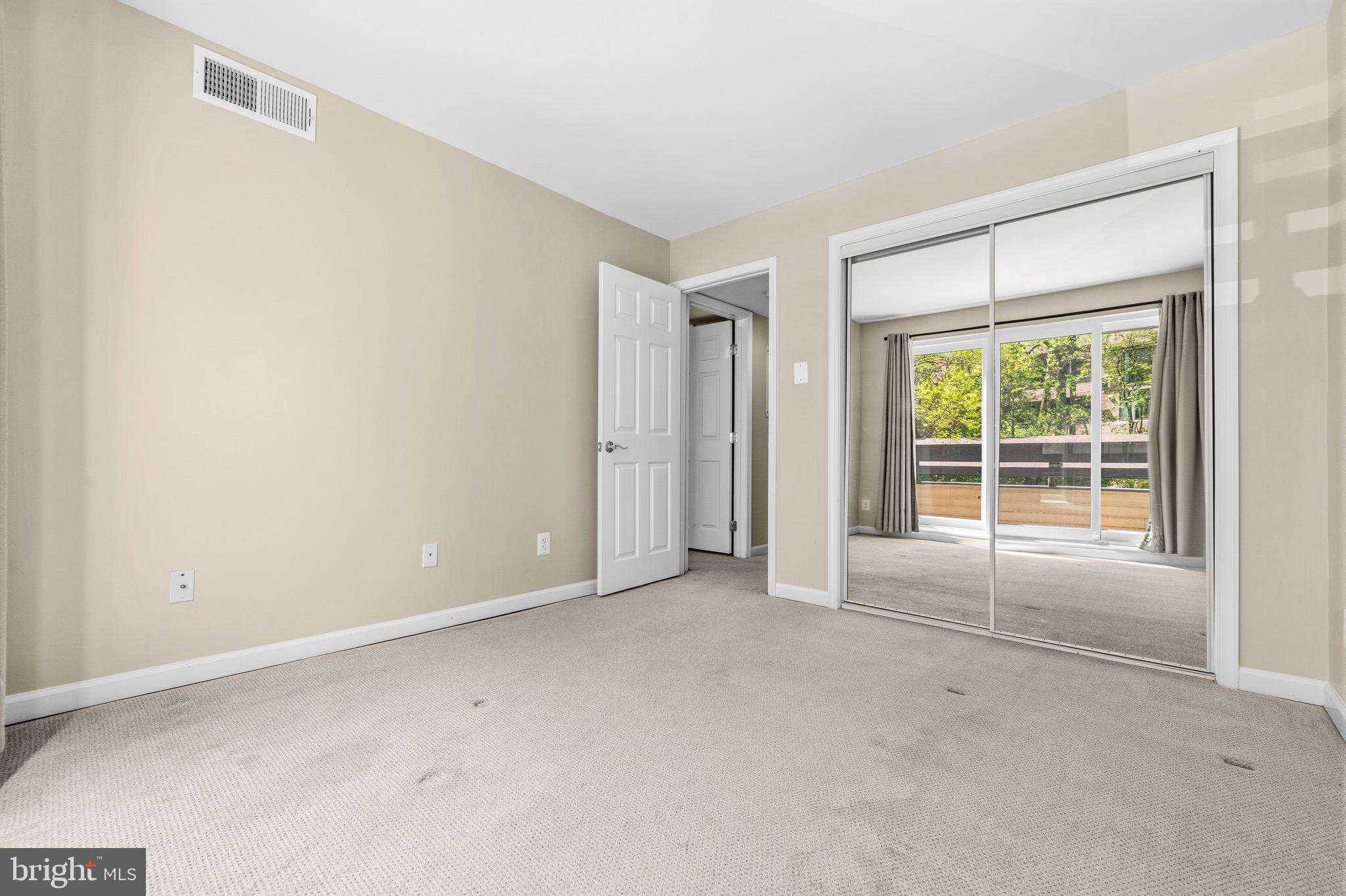 2116 Green Watch Way, Unit 200D Reston, VA 20191 - Photo 23 of 38 an empty room with a window
