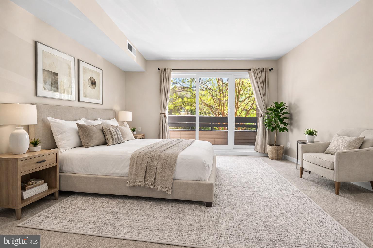 2116 Green Watch Way, Unit 200D Reston, VA 20191 - Photo 25 of 38 a spacious bedroom with a bed and a large window