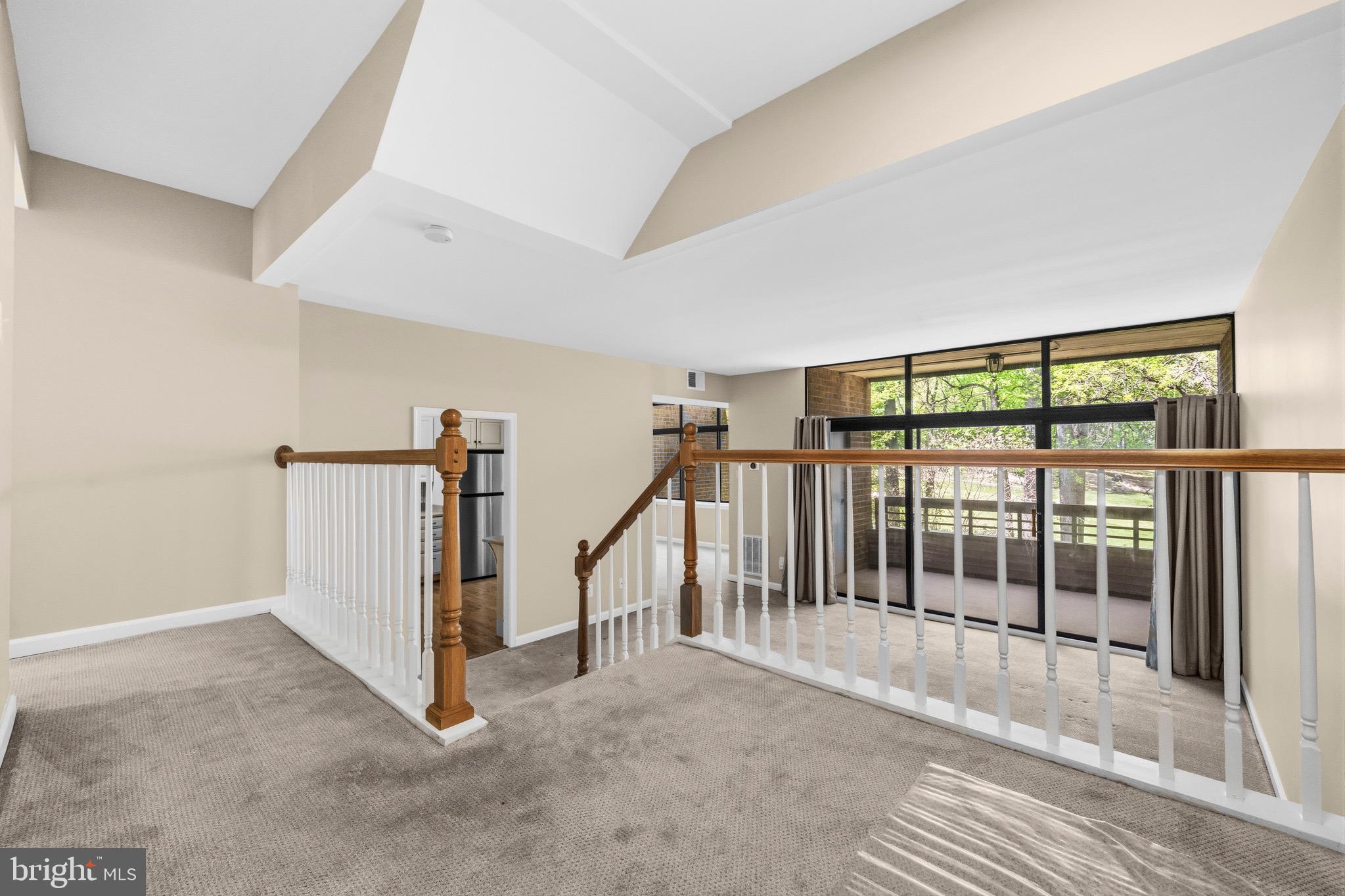 2116 Green Watch Way, Unit 200D Reston, VA 20191 - Photo 4 of 38 a view of a hallway with staircase