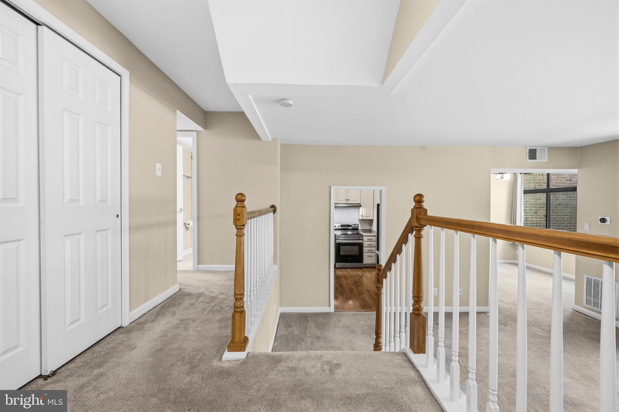 2116 Green Watch Way, Unit 200D Reston, VA 20191 - Photo 5 of 38 a view of a livingroom with stairs