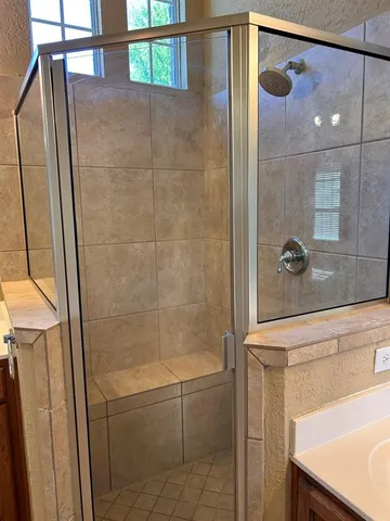 a bathroom with a tub and a window