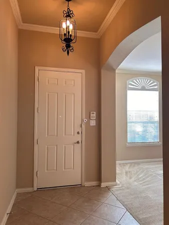 a view of a hallway with windows