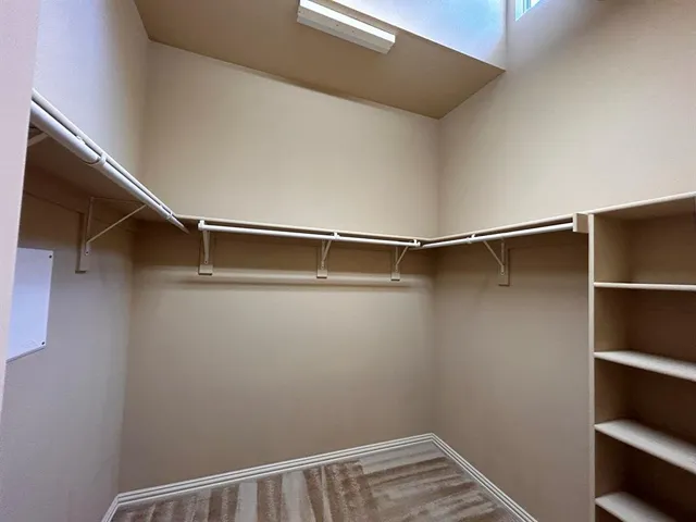 a room with wooden floor and furniture