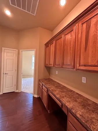 an empty room with a empty space and a window