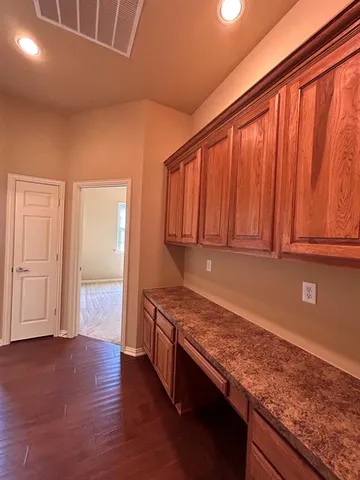 an empty room with a empty space and a window