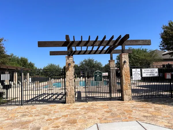 a view of a swimming pool with chairs in patio
