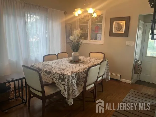 a dining room with furniture and window