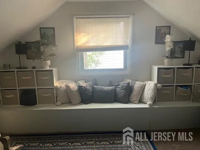 a living room with furniture and window