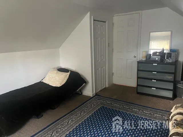 a living room with a couch and a window