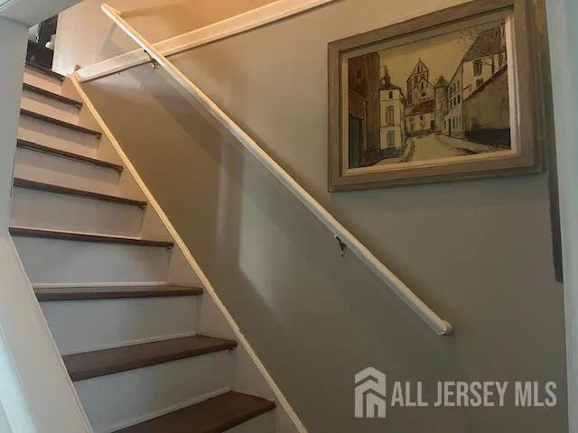 a bedroom with a bed and a chair in it