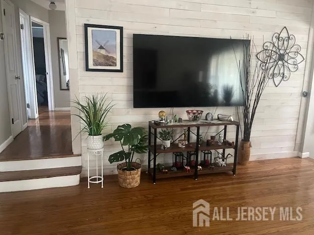 a view of a deck with table and chairs with wooden floor and fence