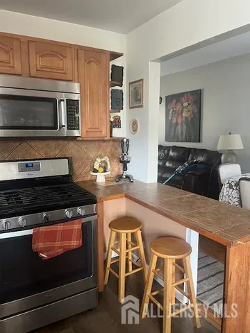 a kitchen with a stove and a microwave