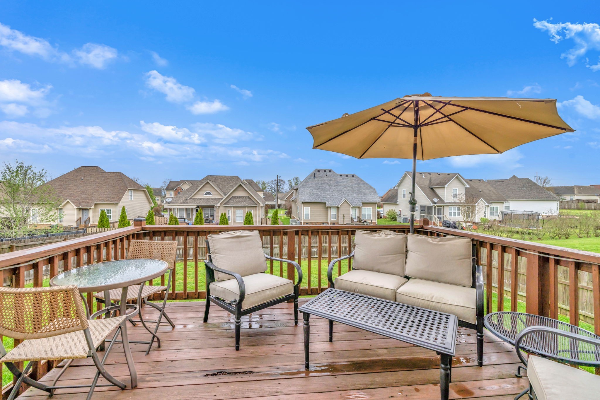 7023 Nickalus Way Spring Hill, TN 37174 - Photo 54 of 67 a view of a balcony with wooden floor and outdoor seating
