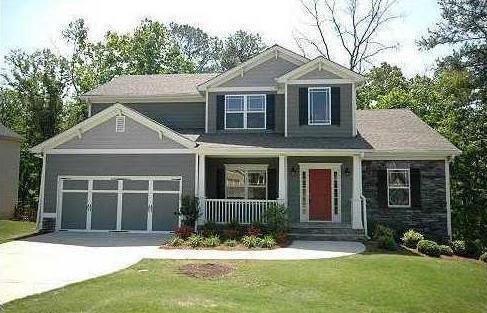 247 Potomac Drive Dallas, GA 30132 - Photo 1 of 1 a front view of a house with a yard and garage