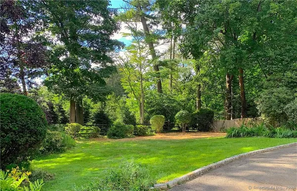 a view of outdoor space with deck area and trees