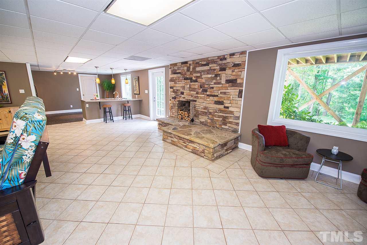 6820 Lake Wheeler Road Raleigh, NC 27603 - Photo 11 of 25 Gorgeous stone mantle and tile flooring.