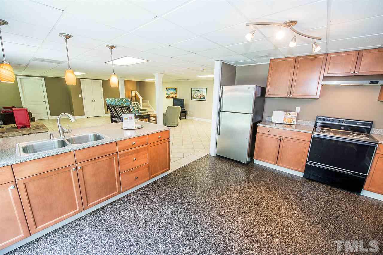 6820 Lake Wheeler Road Raleigh, NC 27603 - Photo 13 of 25 A view of the basement den from the open kitchen.