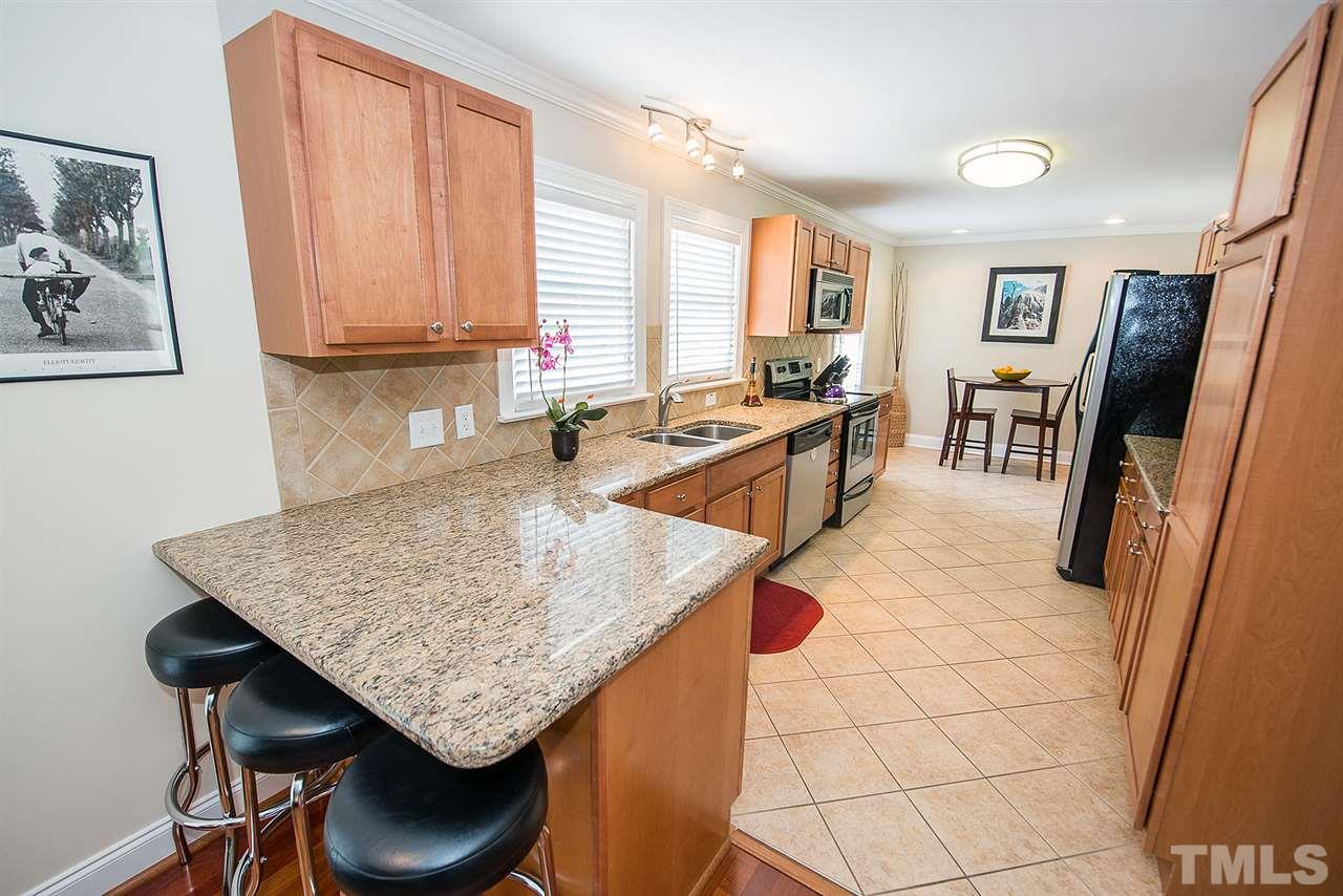 6820 Lake Wheeler Road Raleigh, NC 27603 - Photo 6 of 25 A view of the breakfast room from the kitchen serving bar.