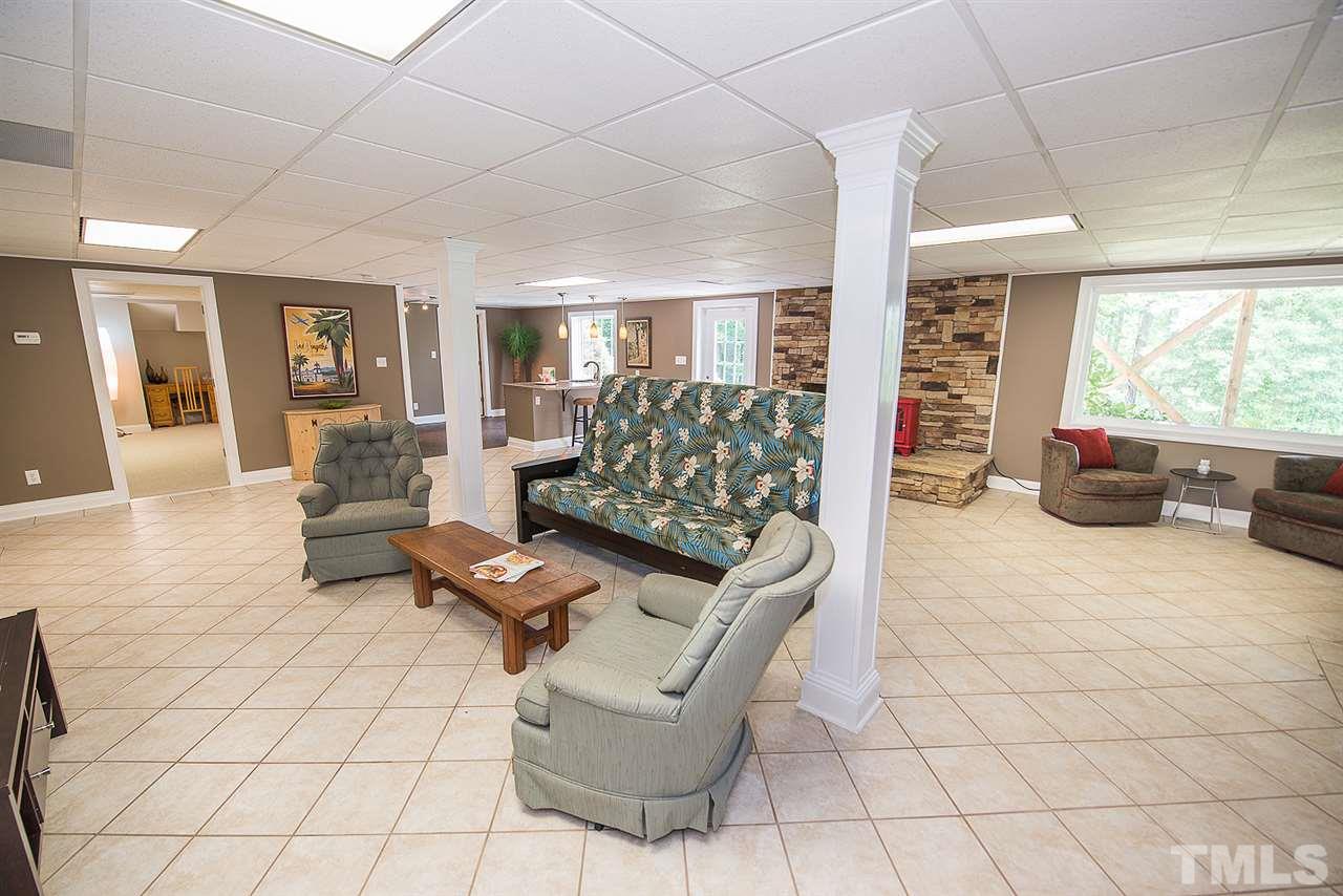 6820 Lake Wheeler Road Raleigh, NC 27603 - Photo 10 of 25 Daylight basement could be an apartment or in-law suite. View of the basement den/rec room.