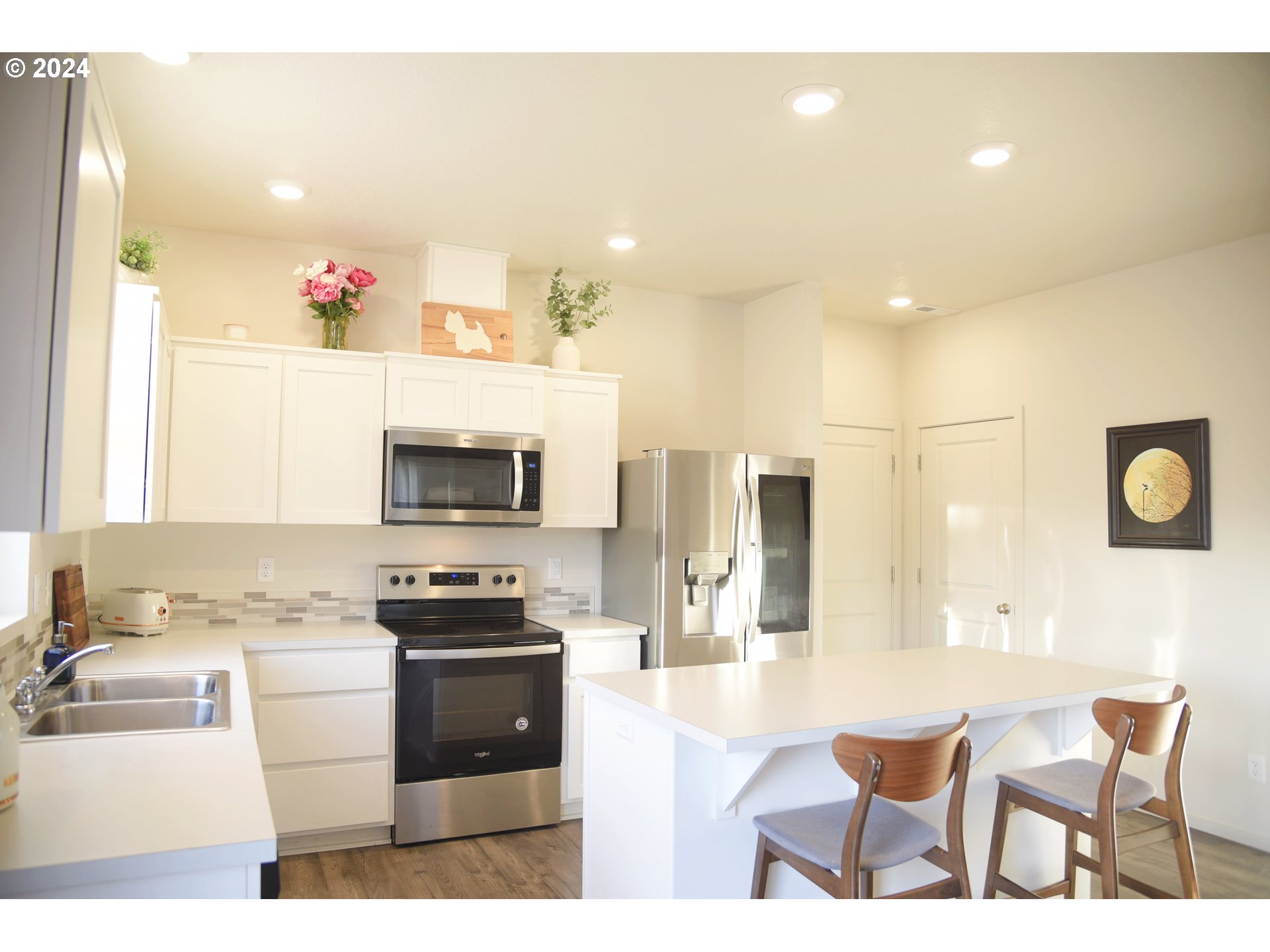 2991 W Street Springfield, OR 97477 - Photo 11 of 43 a kitchen with a sink and chairs