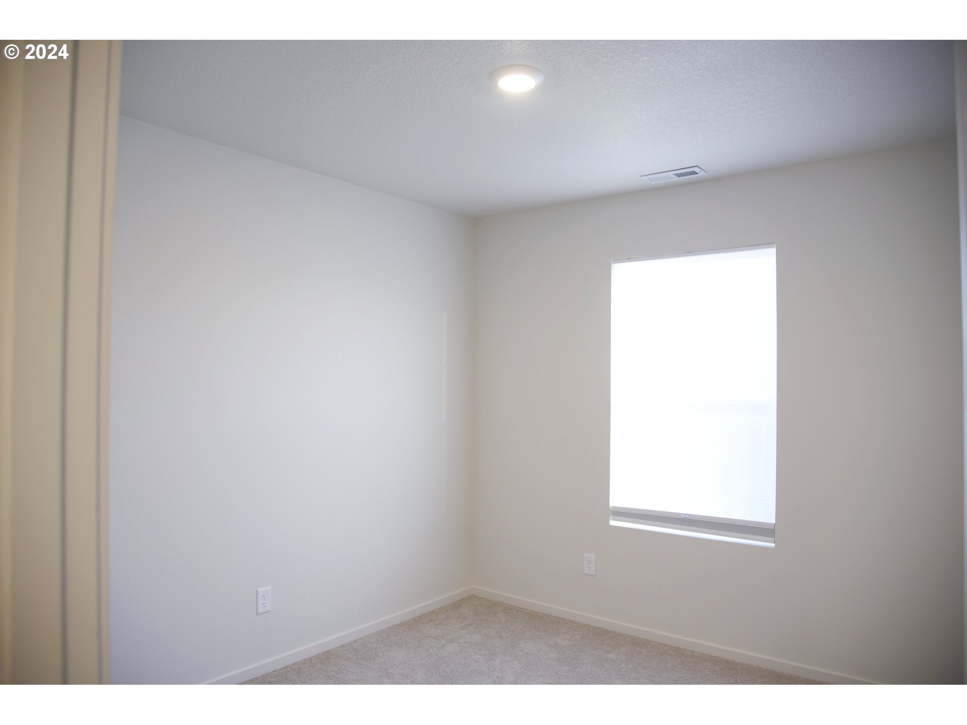 2991 W Street Springfield, OR 97477 - Photo 19 of 43 a view of an empty room with a window