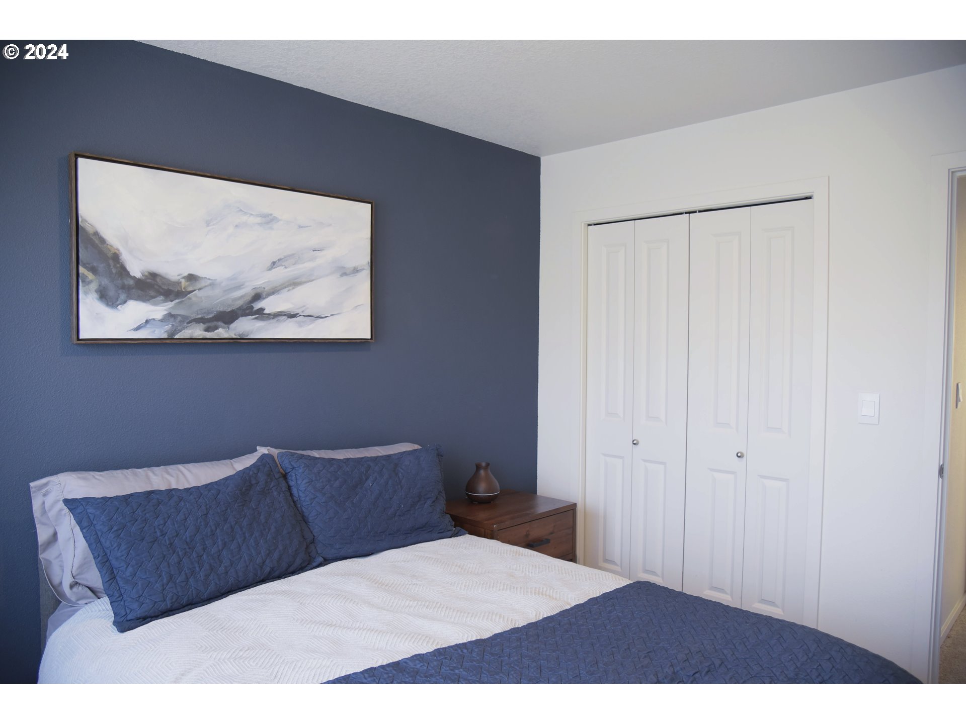 2991 W Street Springfield, OR 97477 - Photo 22 of 43 a bedroom with a bed and painting on the wall