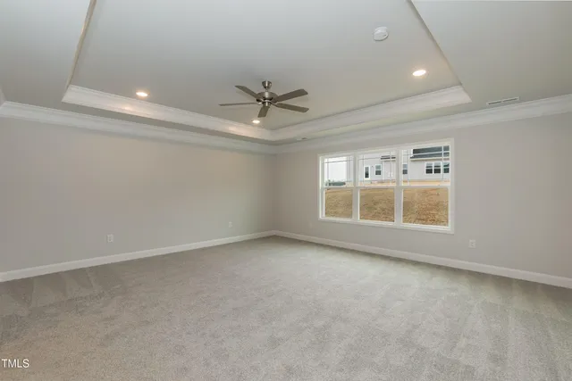 an empty room with a empty space and windows