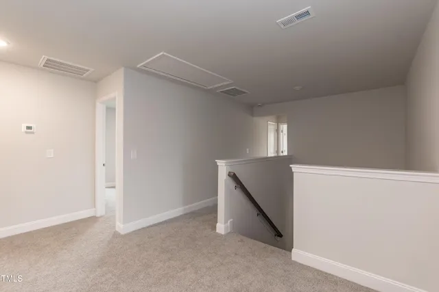 a view of room with stairs and a closet