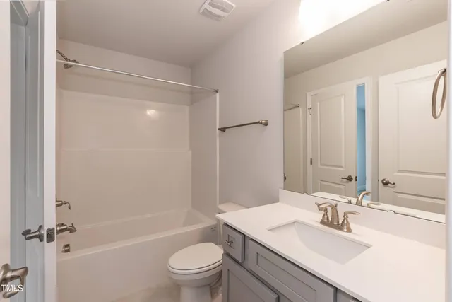 a bathroom with a sink toilet tub and shower