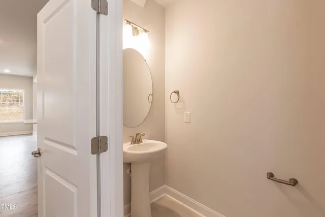 a bathroom with a sink and mirror