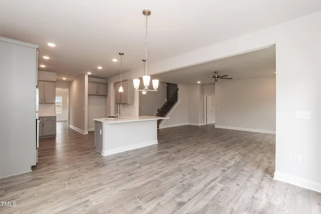 a view of kitchen with refrigerator and window