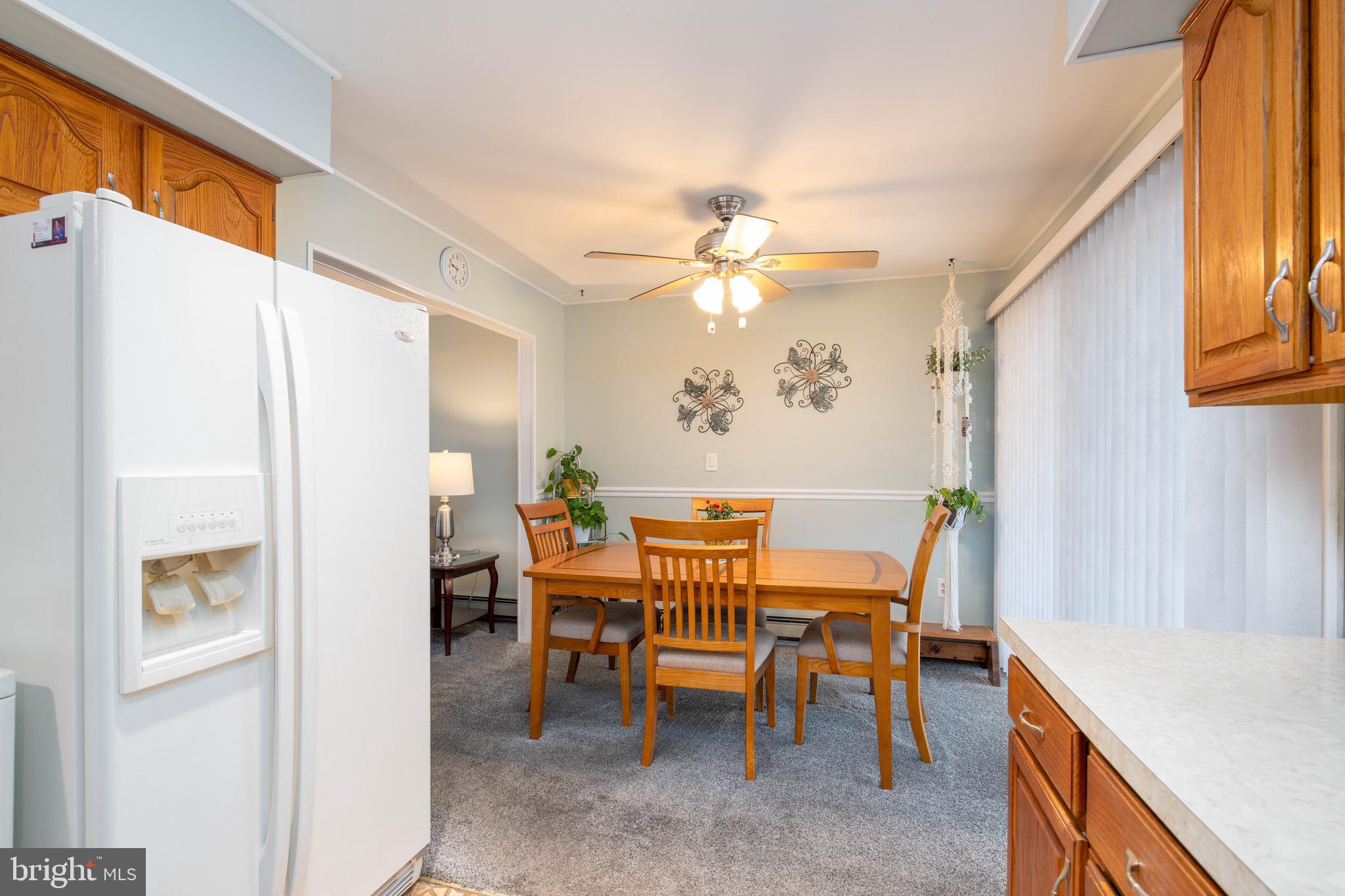 14 Tinder Road Levittown, PA 19056 - Photo 12 of 30 a view of a dining room with furniture and a chandelier