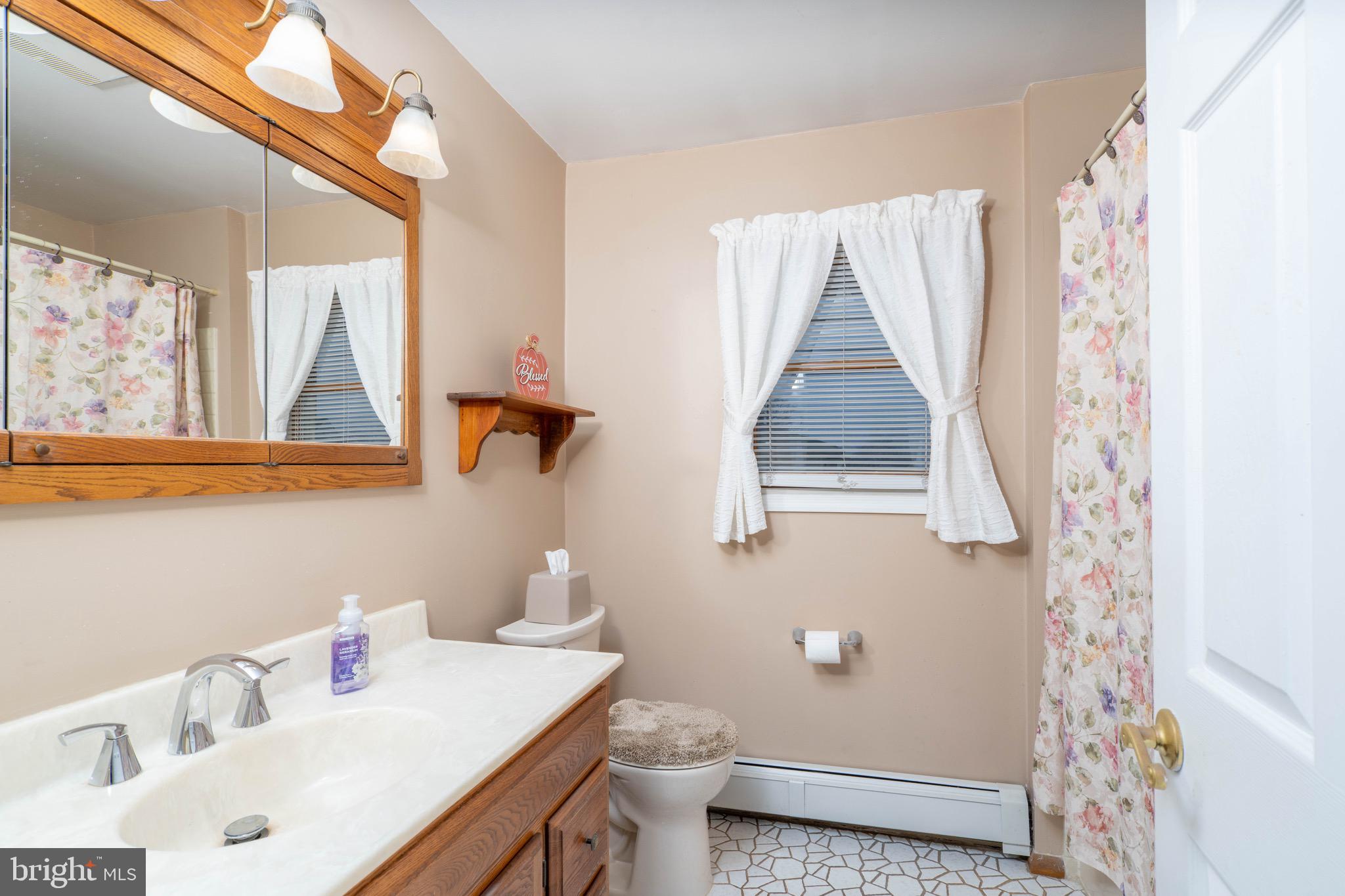 14 Tinder Road Levittown, PA 19056 - Photo 16 of 30 a bathroom with a sink and a toilet