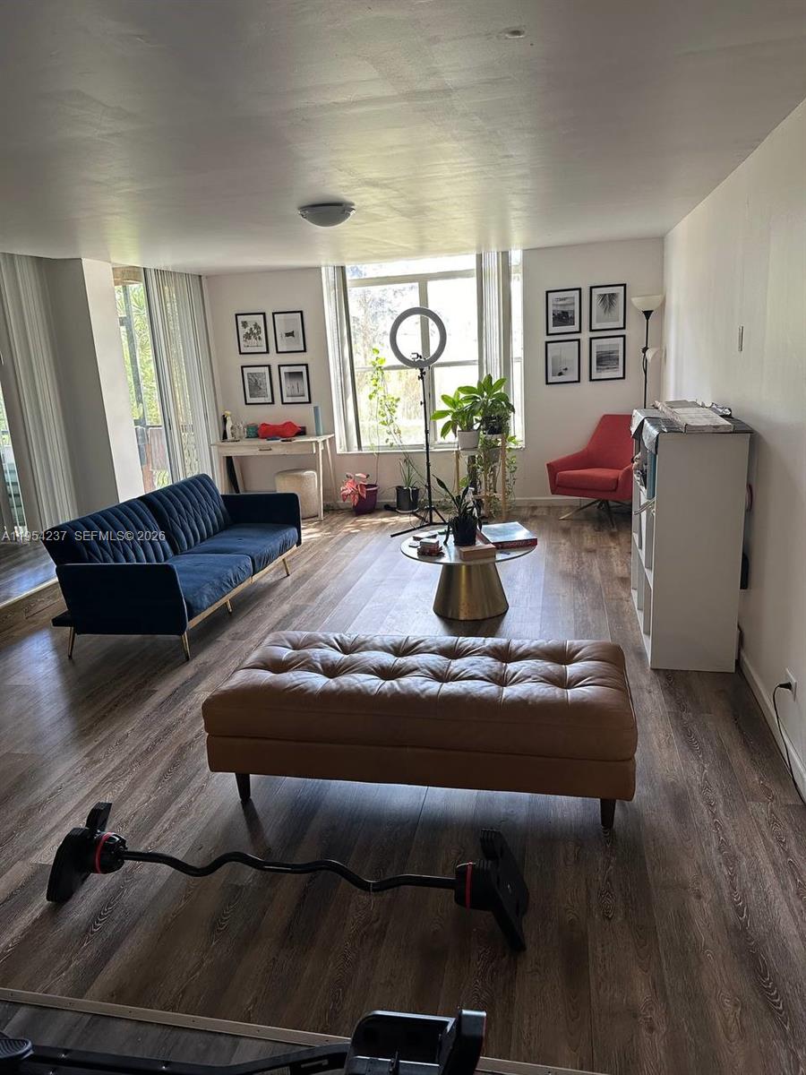 3720 Inverrary Drive, Unit 1L Lauderhill, FL 33319 - Photo 11 of 20 a living room with furniture window and wooden floor