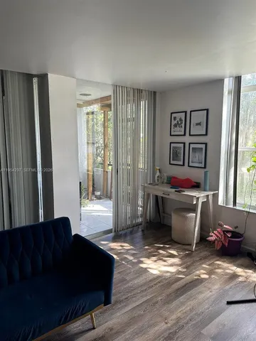 a living room with furniture and window