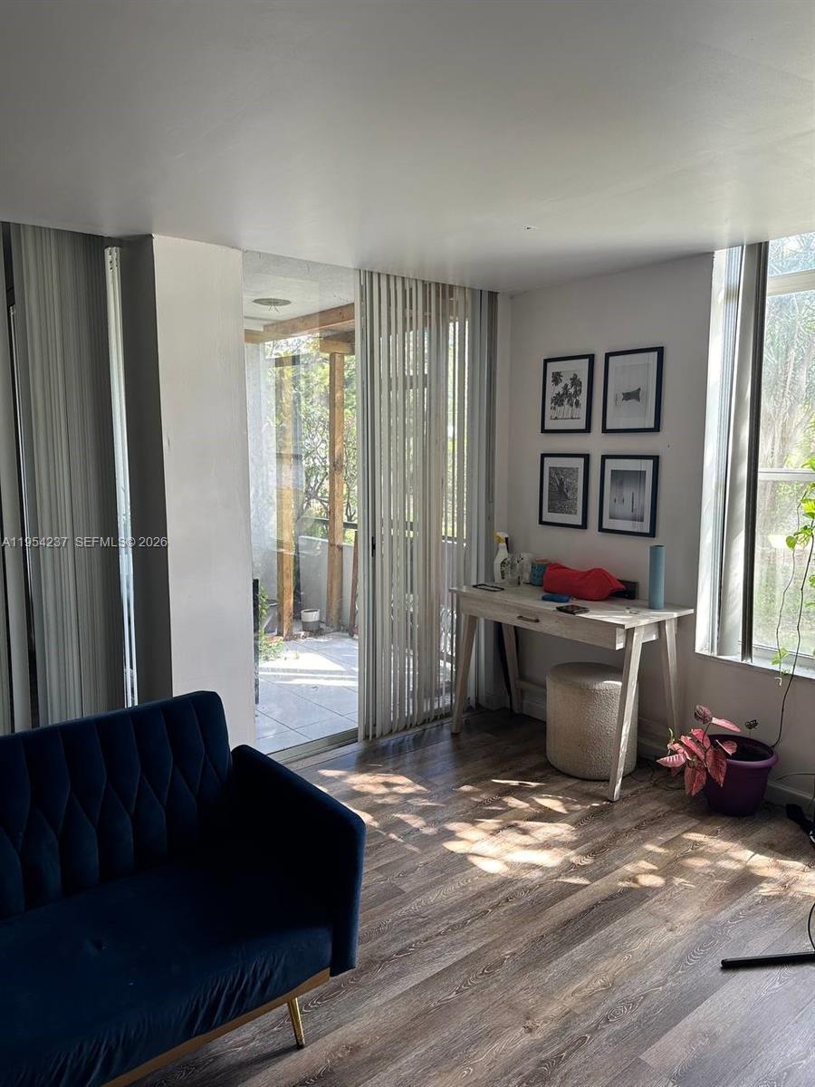 3720 Inverrary Drive, Unit 1L Lauderhill, FL 33319 - Photo 12 of 20 a living room with furniture and window