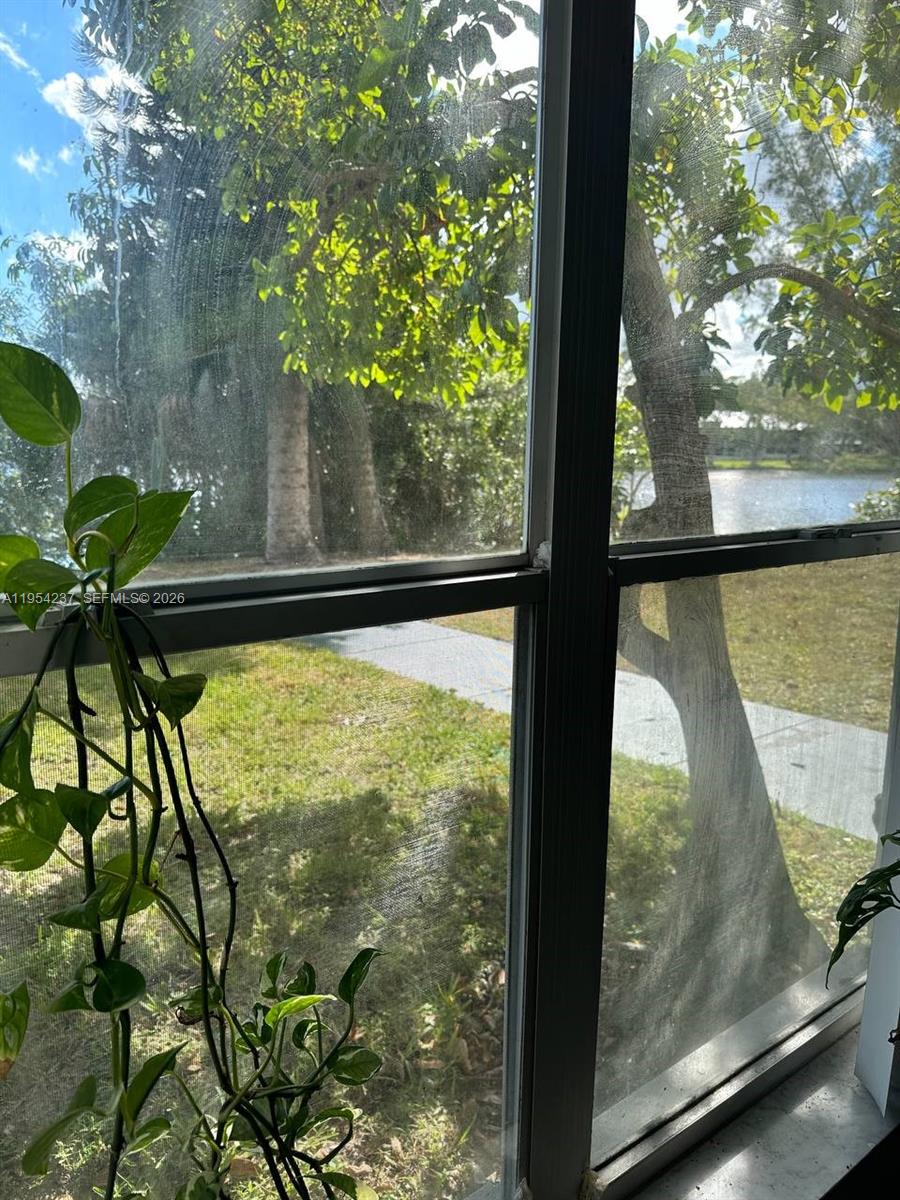 3720 Inverrary Drive, Unit 1L Lauderhill, FL 33319 - Photo 14 of 20 a view of a glass door
