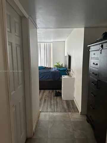 a room with a couch and a stove top oven