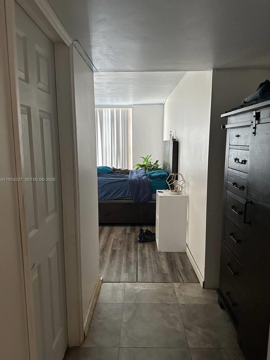 3720 Inverrary Drive, Unit 1L Lauderhill, FL 33319 - Photo 5 of 20 a room with a couch and a stove top oven