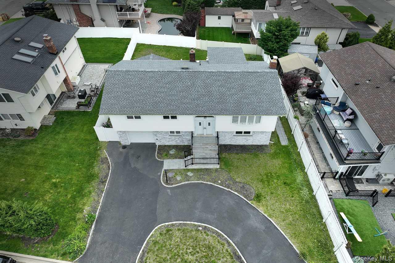 107 Beverly Road Massapequa, NY 11758 - Photo 34 of 41 an aerial view of a house with outdoor space