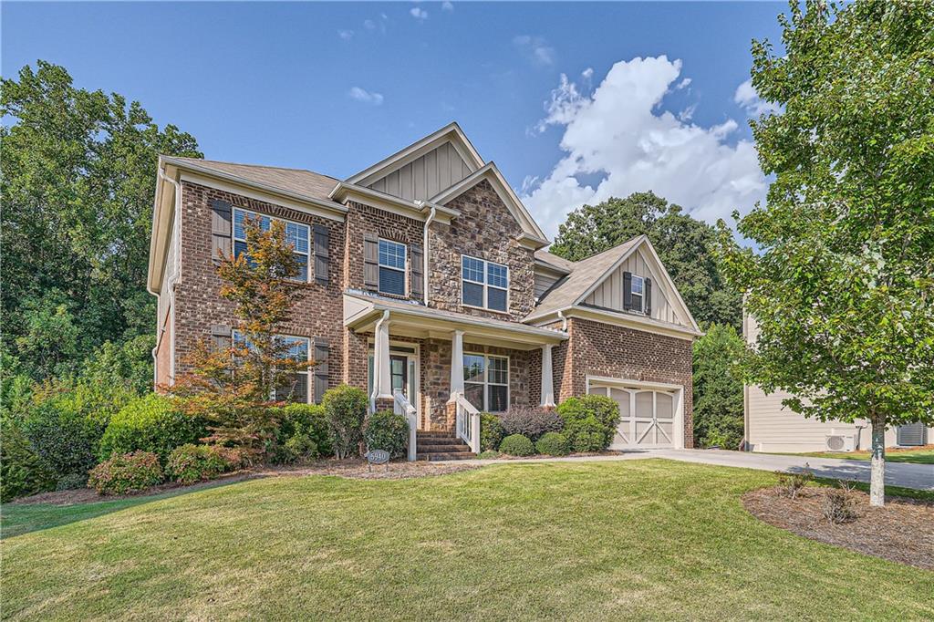 front view of a house with a yard