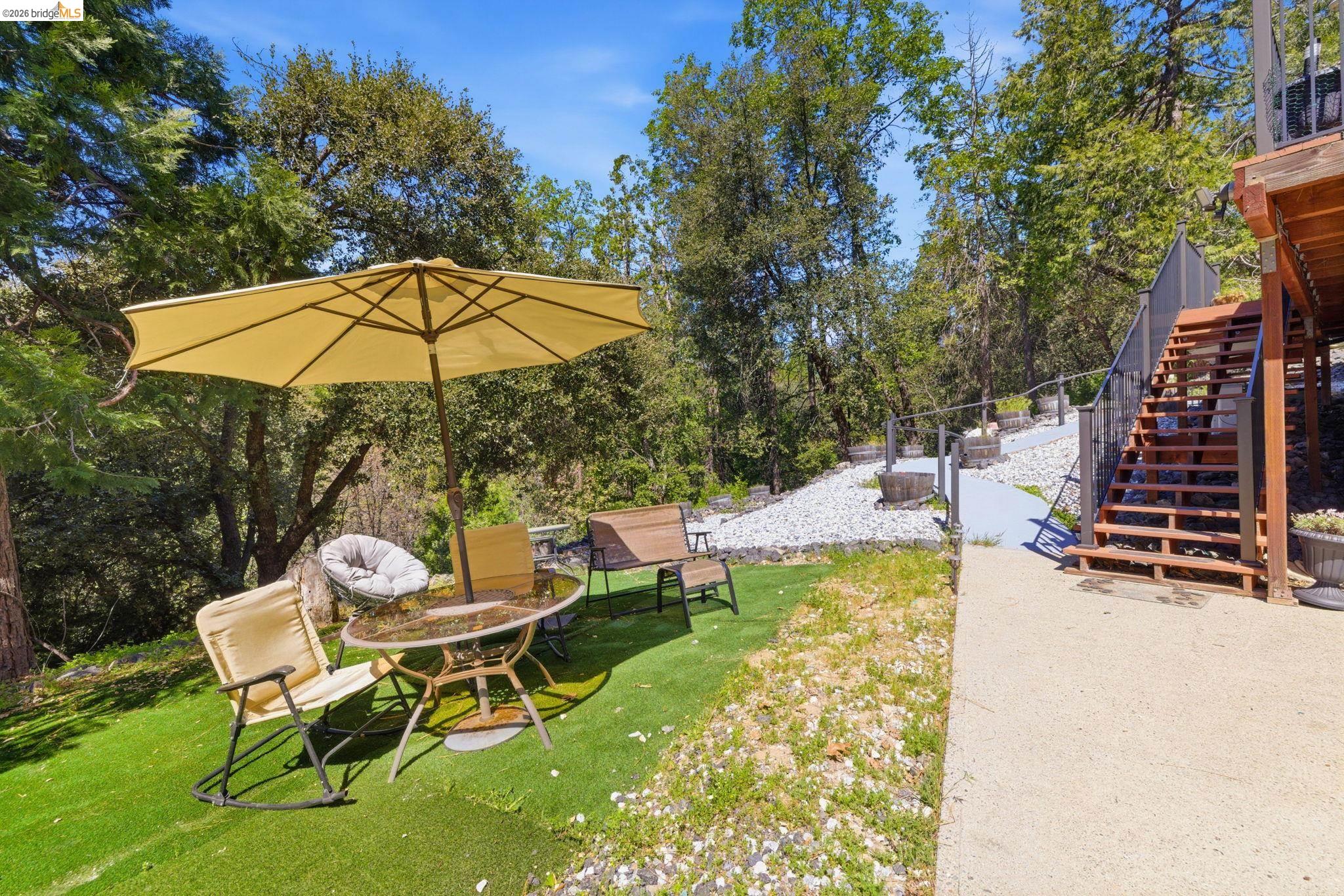 22555 South Fork Road Sonora, CA 95370 - Photo 29 of 35 a view of a chair and table on the garden
