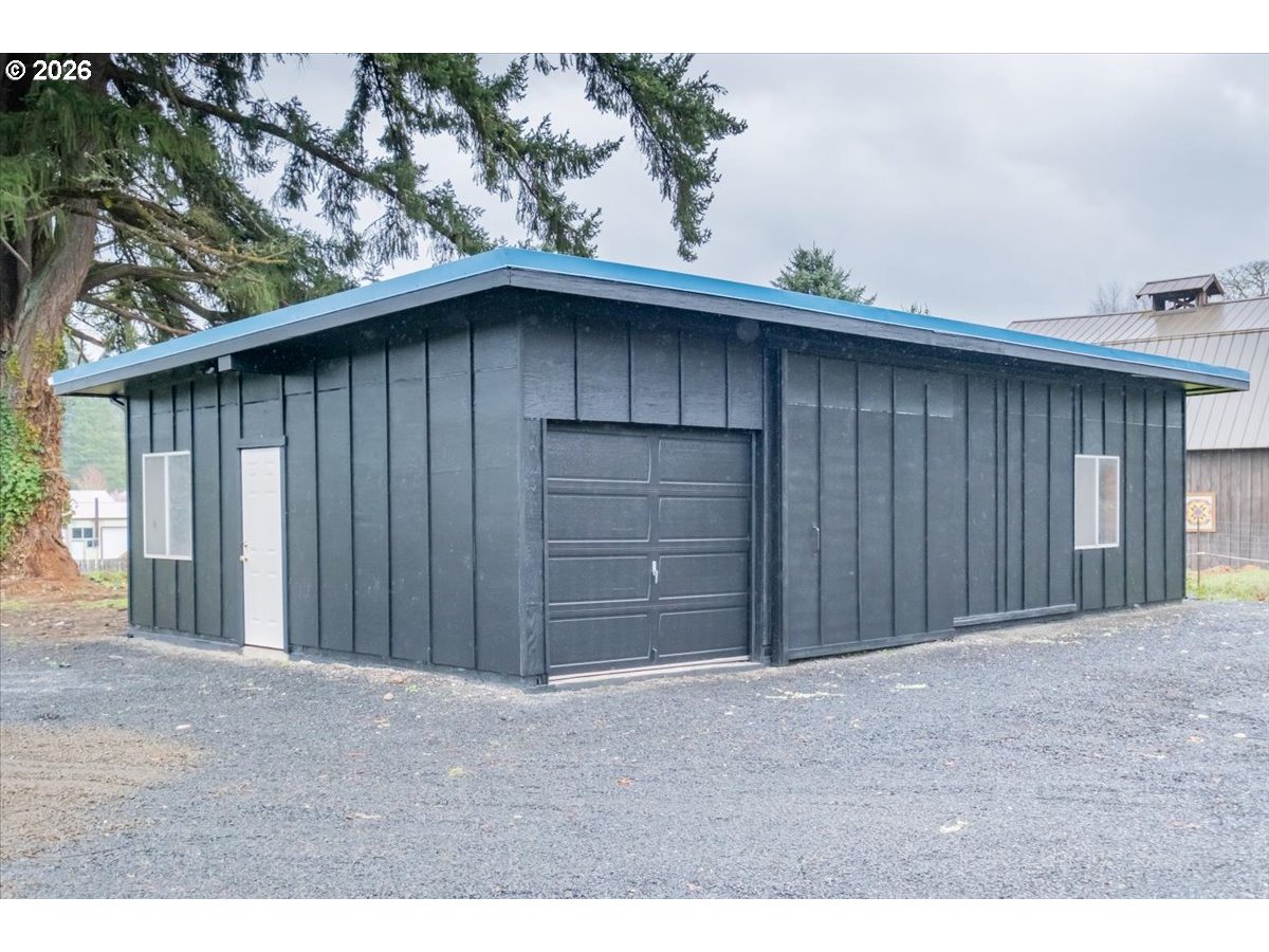 28411 Liberty Road Sweet Home, OR 97386 - Photo 14 of 48 a black white house with a outdoor space