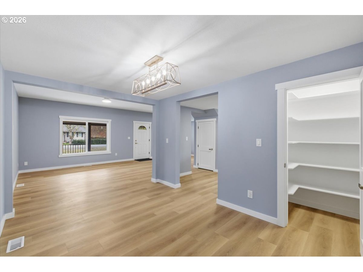 28411 Liberty Road Sweet Home, OR 97386 - Photo 19 of 48 a view of empty room with wooden floor
