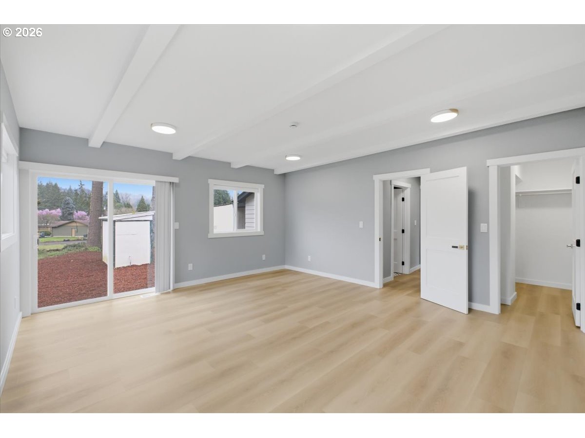 28411 Liberty Road Sweet Home, OR 97386 - Photo 29 of 48 a view of an empty room with wooden floor and a window