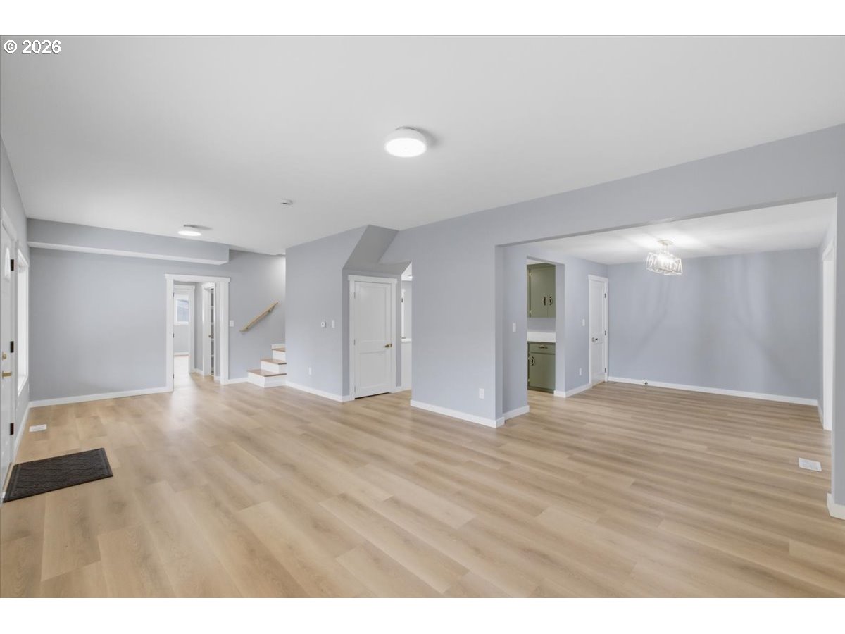 28411 Liberty Road Sweet Home, OR 97386 - Photo 39 of 48 a view of an empty room with wooden floor