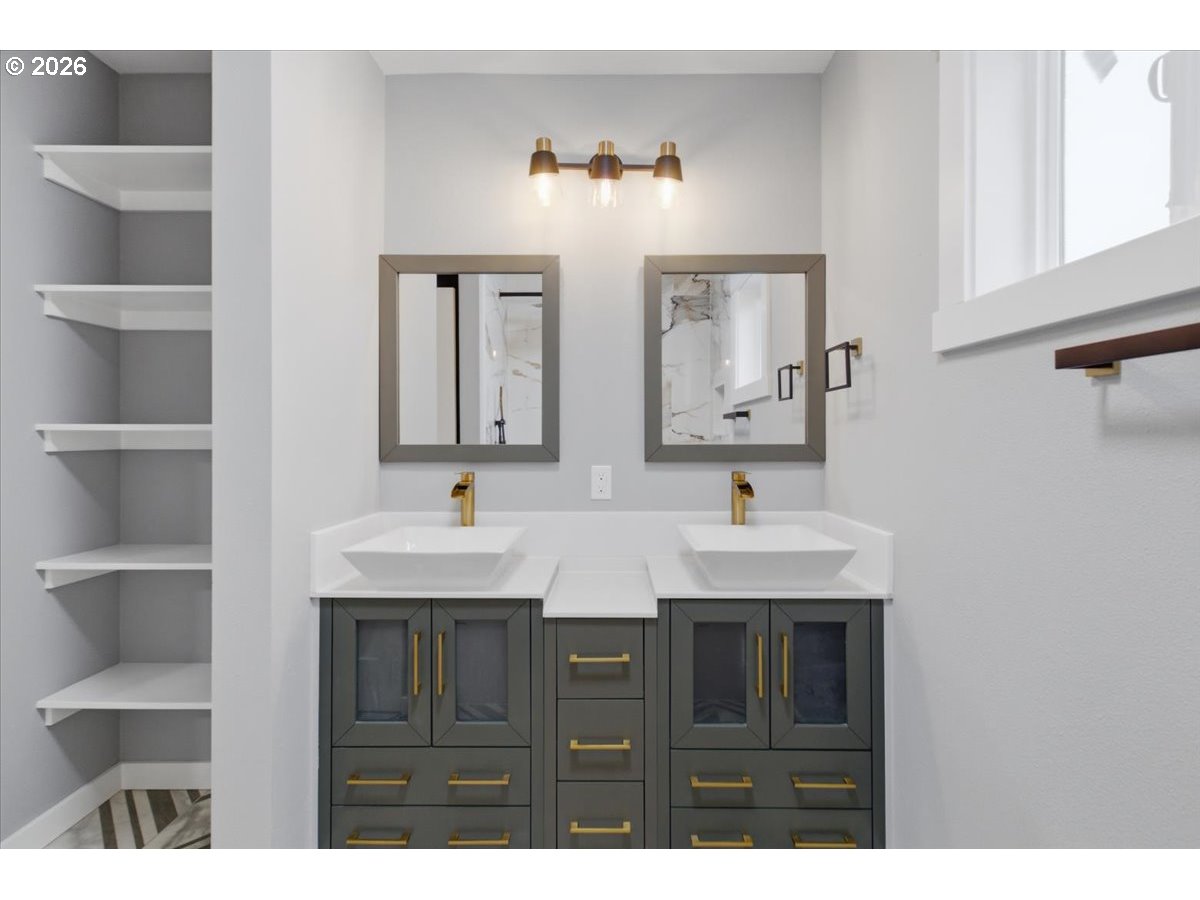 28411 Liberty Road Sweet Home, OR 97386 - Photo 44 of 48 a bathroom with a double vanity sink and mirror