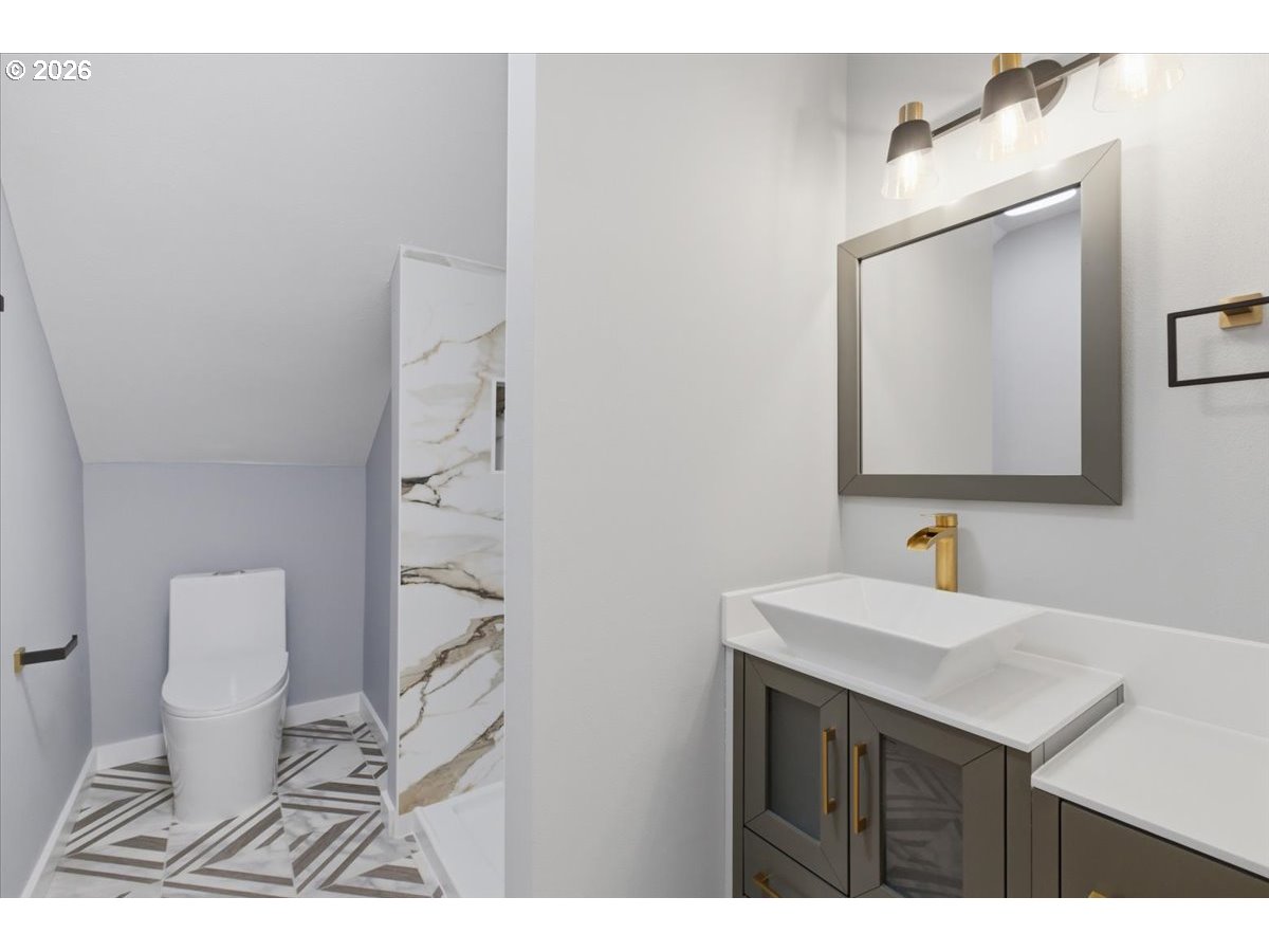 28411 Liberty Road Sweet Home, OR 97386 - Photo 45 of 48 a bathroom with a sink a toilet and mirror