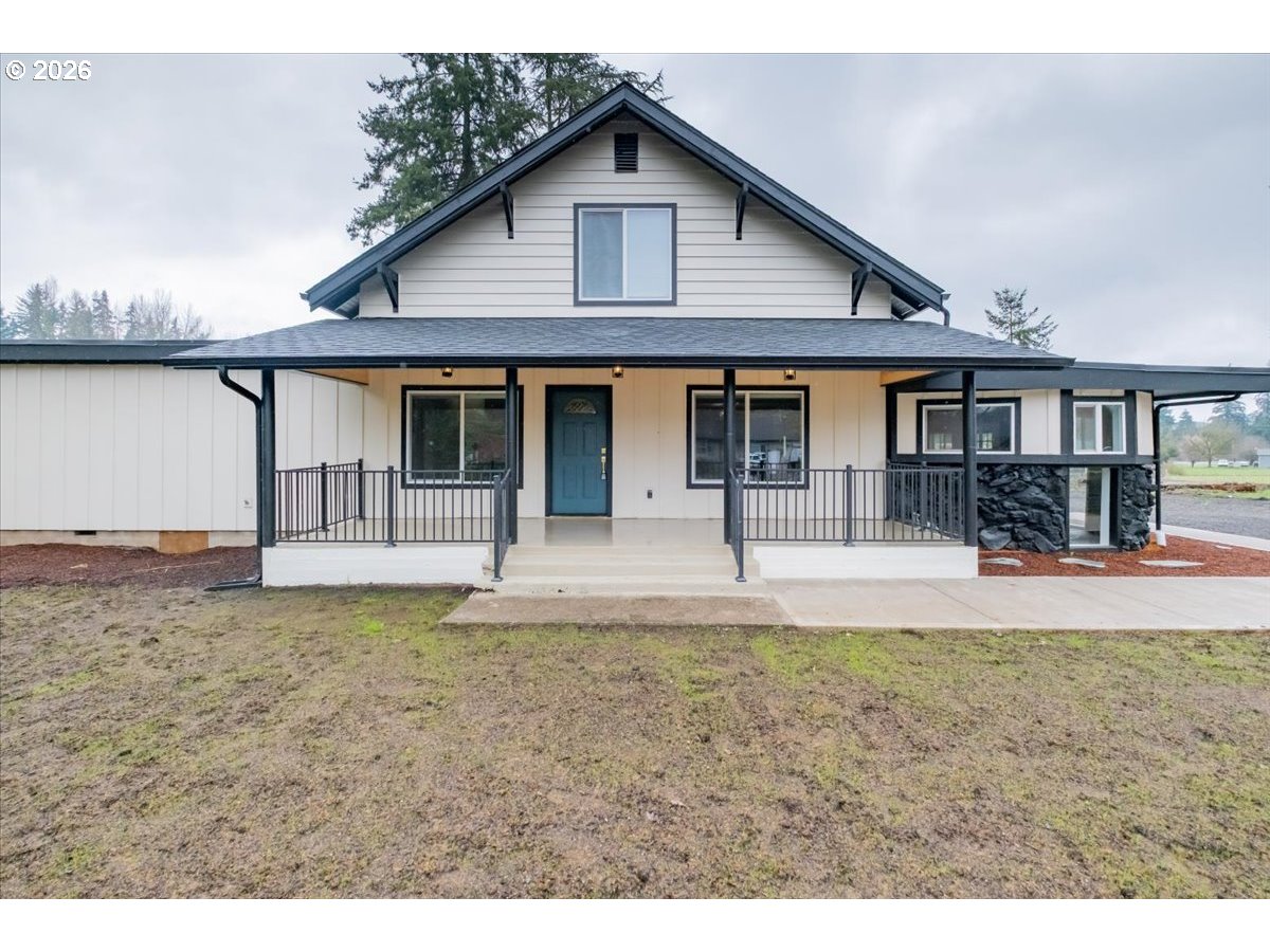 28411 Liberty Road Sweet Home, OR 97386 - Photo 5 of 48 a front view of a house with garden