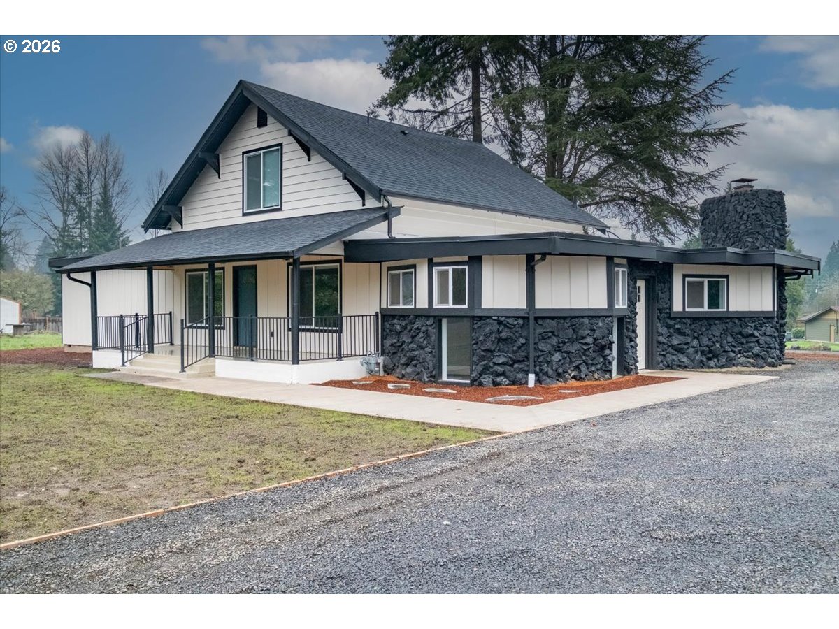28411 Liberty Road Sweet Home, OR 97386 - Photo 6 of 48 a front view of a house with a yard